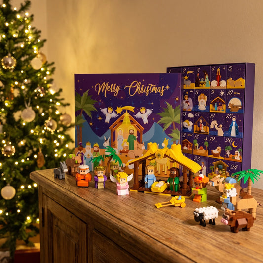 Il presepe di mattoncini completo accanto all'albero di Natale